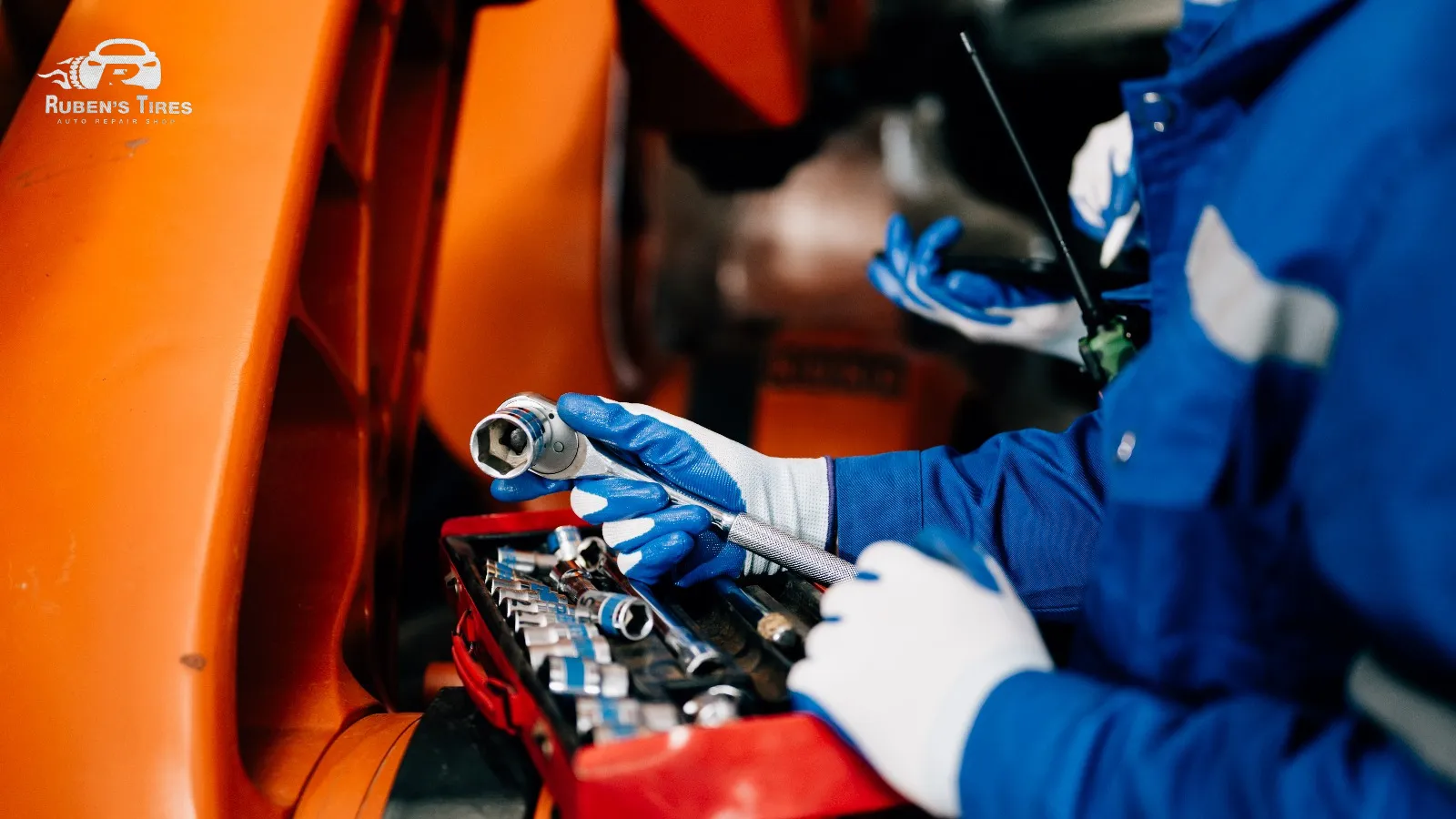 Mechanic handling transmission repair tools at Ruben's Tires in Apopka.