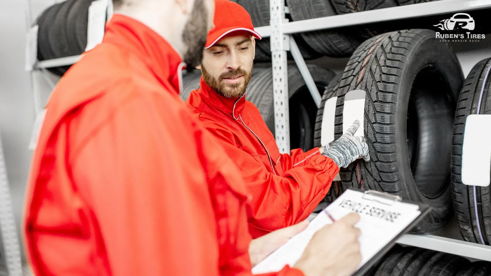 Two professionals selecting tires at Ruben's Tires near Apopka.